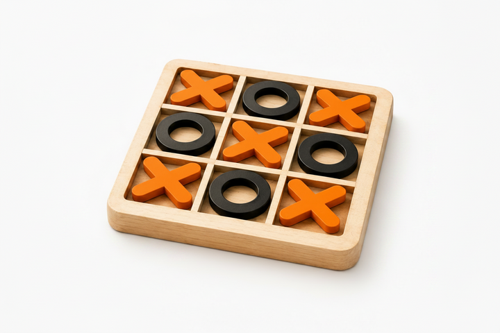 A wooden 3-in-1 tic-tac-toe game board with orange X-shaped pieces and black O-shaped rings, shown on a light gray background with a faint Orenta brand watermark.